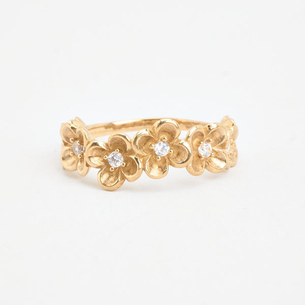 Blomsterring i 8K guld med en zirkonia strl. 18.5 / strl. 58