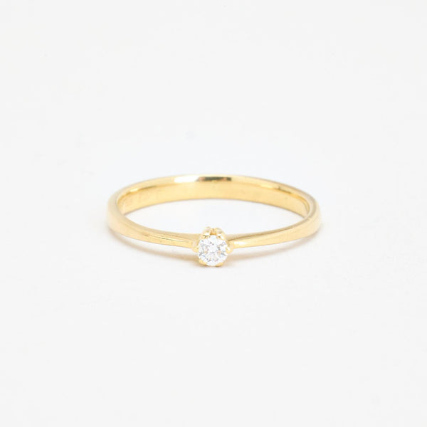 Solitärring med diamant (0.06 ct) i 14K guld strl. 15.3 / strl. 48