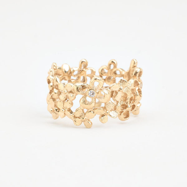 Blomsterring i 8K guld med en zirkonia strl. 19.1 / strl. 60