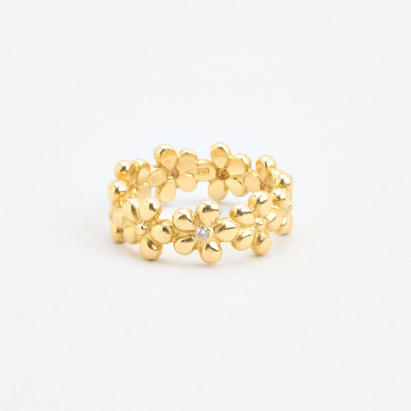 Blomsterring med diamant (0.03 ct) i 18K guld strl. 19.7 / strl. 62